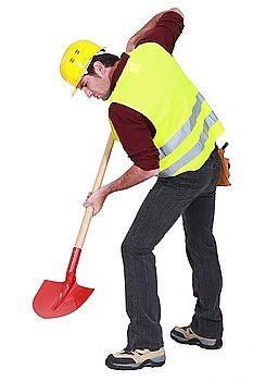 Worker digging with a shovel