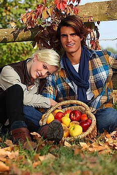A couple taking a break from picking apples