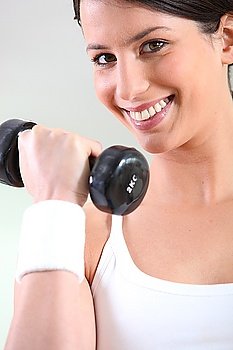 Young woman with hand weights