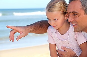 Father pointing something out to his daughter
