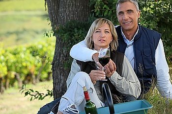 couple on a romantic picnic in a vineyard