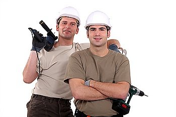 Two manual workers with drills