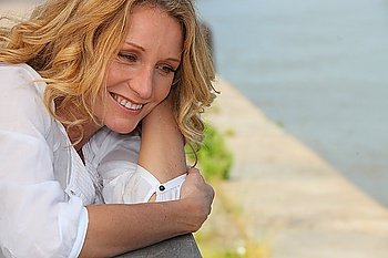 Smiling woman on a boardwalk