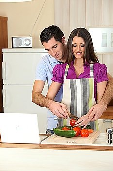 Man and woman preparing a meal together