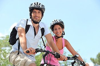 Couple on bicycle helmet
