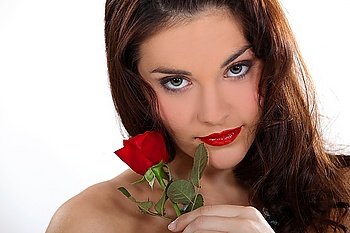 Sexy woman holding a rose