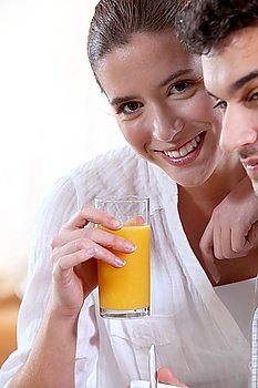 Couple drinking fruit juice