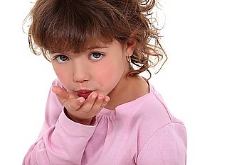 Young girl blowing a kiss