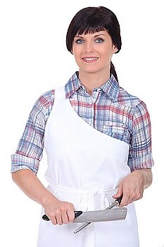 Female chef stood with knife and sharpener