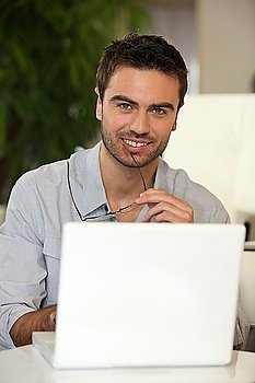Man sat with laptop computer