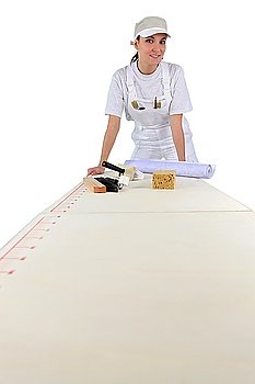 Woman about to hand wallpaper
