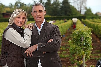 Couple in front of vineyard