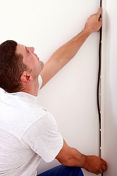 electrician installing cable