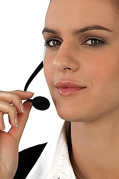 Close-up of a woman using a telephone headset