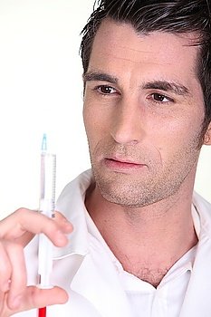 man holding an injection