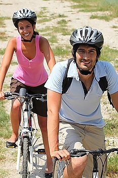 Couple enjoying leisurely bike ride