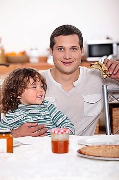 Father and son eating pancakes