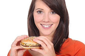 Young woman eating burger