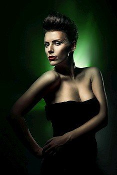 beautiful woman with red lips in dark green light