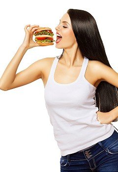 cute girl eating hamburger on white background