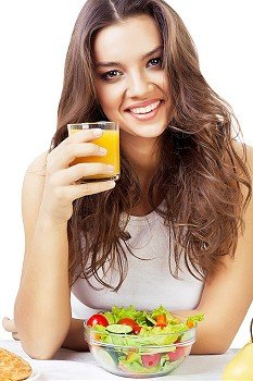 happy girl with juice on white background