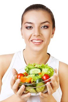healthy woman and salad in hands on white background