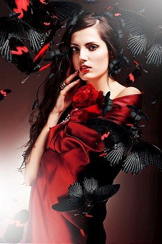 sexy woman in red fabric with red rose and butterflies