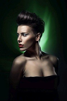 sexy woman with red lips in green light