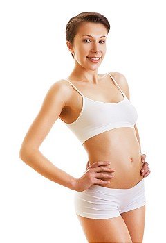 sporty woman with perfect skin on white background