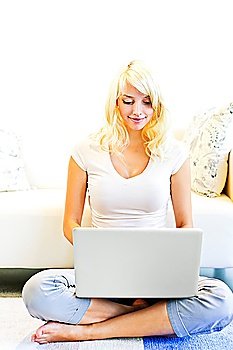 Young woman using computer at home