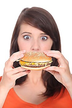 Surprise in front of a hamburger