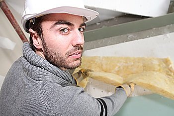 Man insulating a room