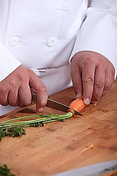 Man cutting carrots