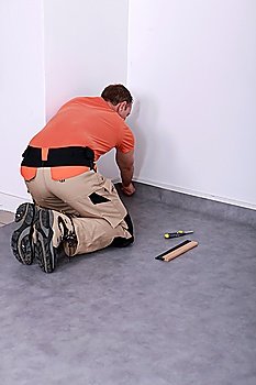 Men putting carpet