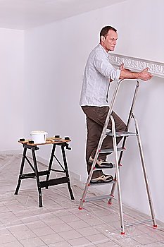 Man placing molding