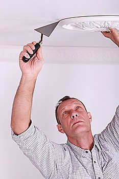 plasterer laying ceiling moulding