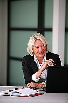 Senior businesswoman laughing