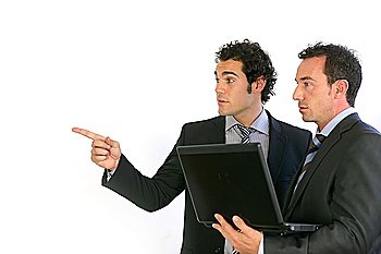 Businessmen with a laptop pointing at copyspace