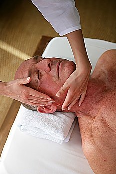 Man receiving face massage