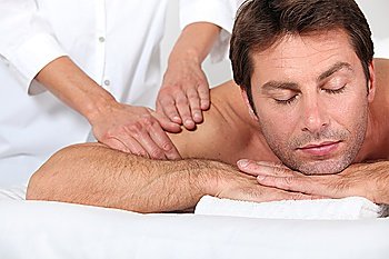 Man receiving shoulder massage