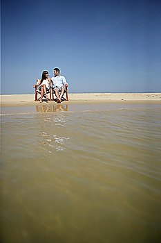 Couple sitting on a beach