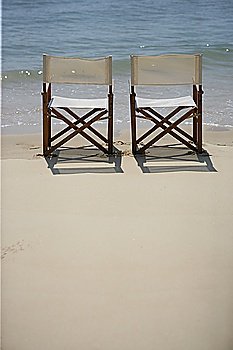 Empty deckchairs on a beach