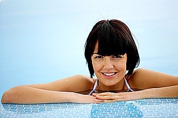 Brunette in a swimming pool