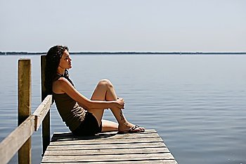 Woman sitting on a pontoon