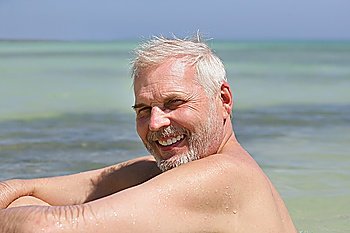 Senior man alone at the beach