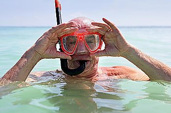 Older man snorkelling