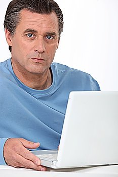 middle-aged man with laptop