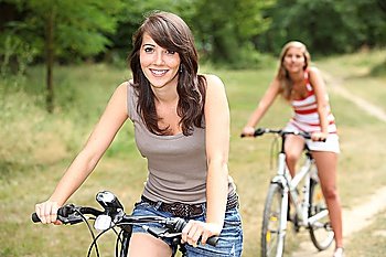 portrait of two girls on bikes