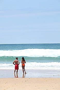 Rear shot of couple at the beach