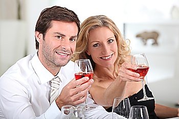 Couple holding wine glasses